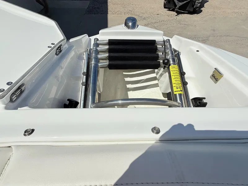 Slide: The Image of 2018 Monterey 218 Super Sport boat ladder and storage compartment. - 10