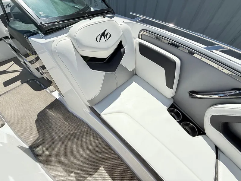 Slide: The Image of 2018 Monterey 218 Super Sport boat interior with white and black seating. - 12