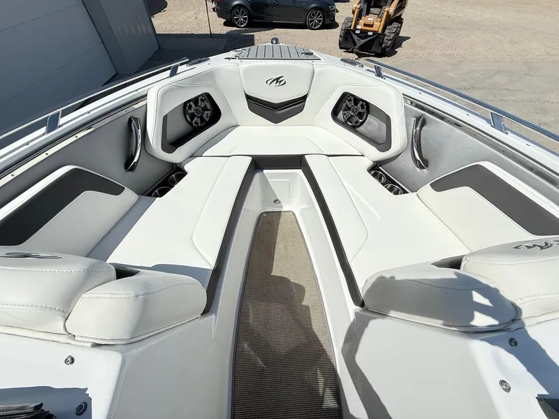Slide: The Image of 2018 Monterey 218 Super Sport boat interior with white seating and modern design. - 13