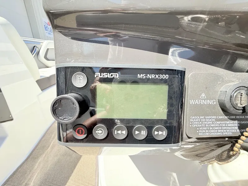 Slide: The Image of Fusion MS-NRX300 audio system on 2018 Monterey 218 Super Sport boat dashboard. - 18