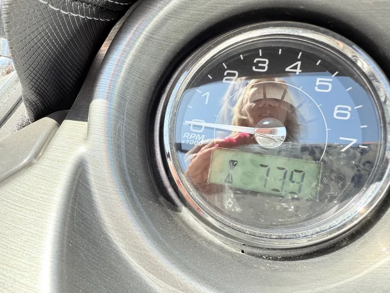 Slide: The Image of Close-up of a 2018 Monterey 218 Super Sport tachometer displaying 739 RPM. - 19
