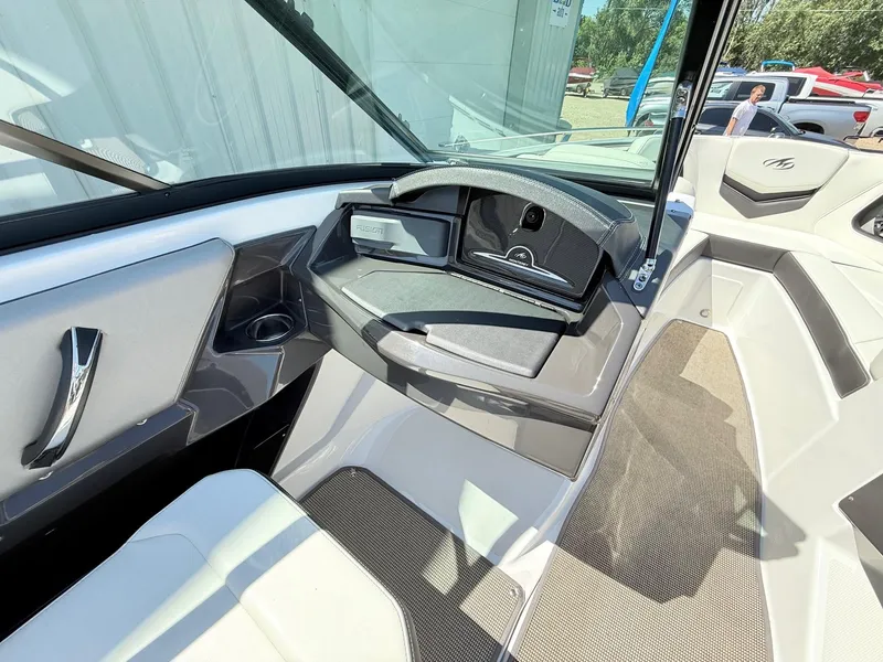 Slide: The Image of Interior of 2018 Monterey 218 Super Sport boat with modern dashboard and seating. - 22