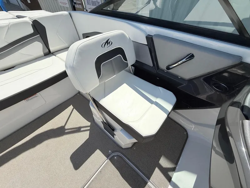 Slide: The Image of 2018 Monterey 218 Super Sport boat interior with white seating and sleek design. - 23