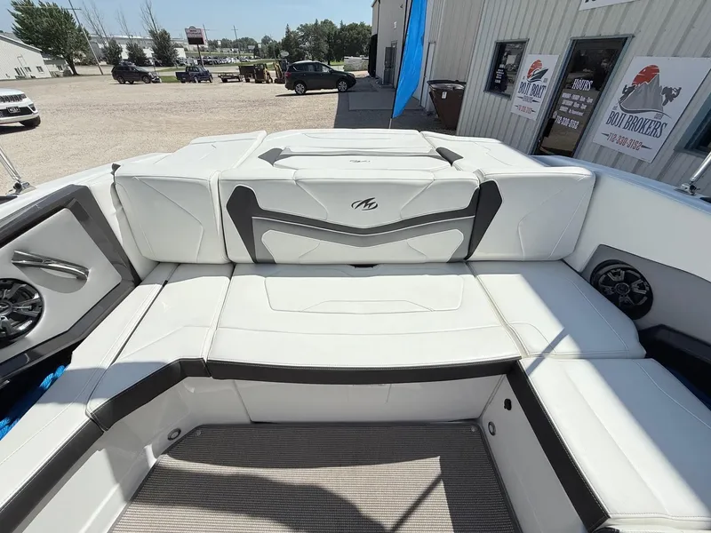 Slide: The Image of 2018 Monterey 218 Super Sport boat interior with white seating and modern design. - 27