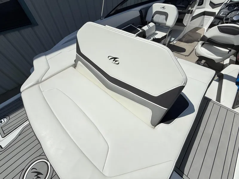 Slide: The Image of 2018 Monterey 218 Super Sport boat interior with white seating and sleek design. - 32