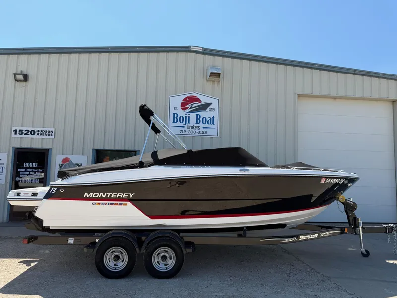 Slide: The Image of 2018 Monterey 218 Super Sport boat on trailer outside Boji Boat dealership. - 38