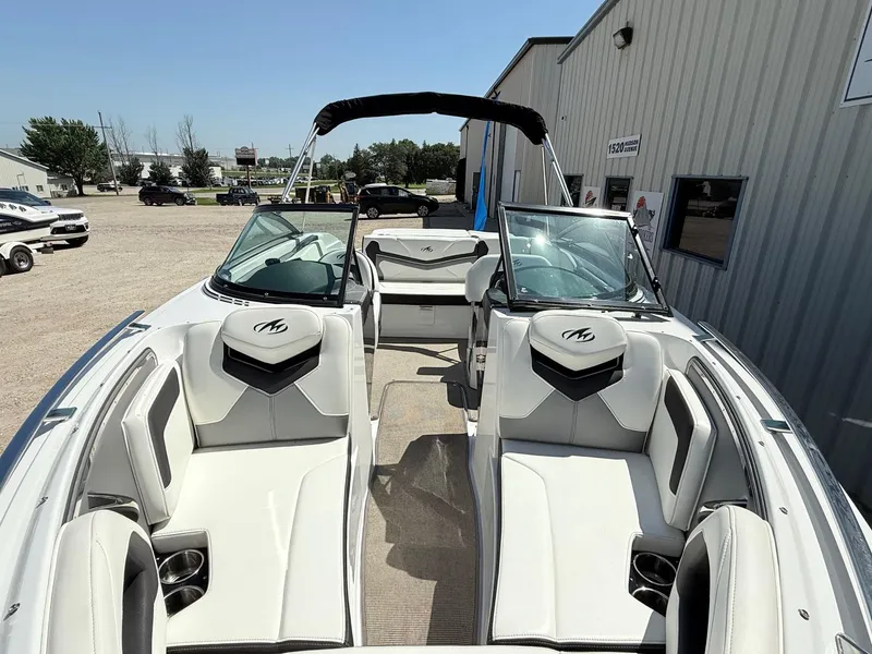 Slide: The Image of 2018 Monterey 218 Super Sport boat with sleek white interior and comfortable seating. - 4