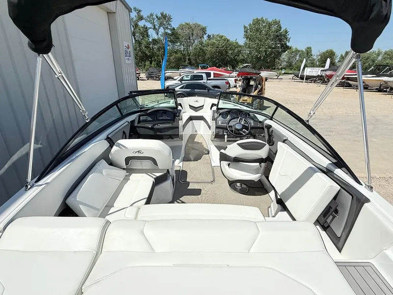 Slide: The Image of 2018 Monterey 218 Super Sport boat interior with seating and steering wheel. - 9