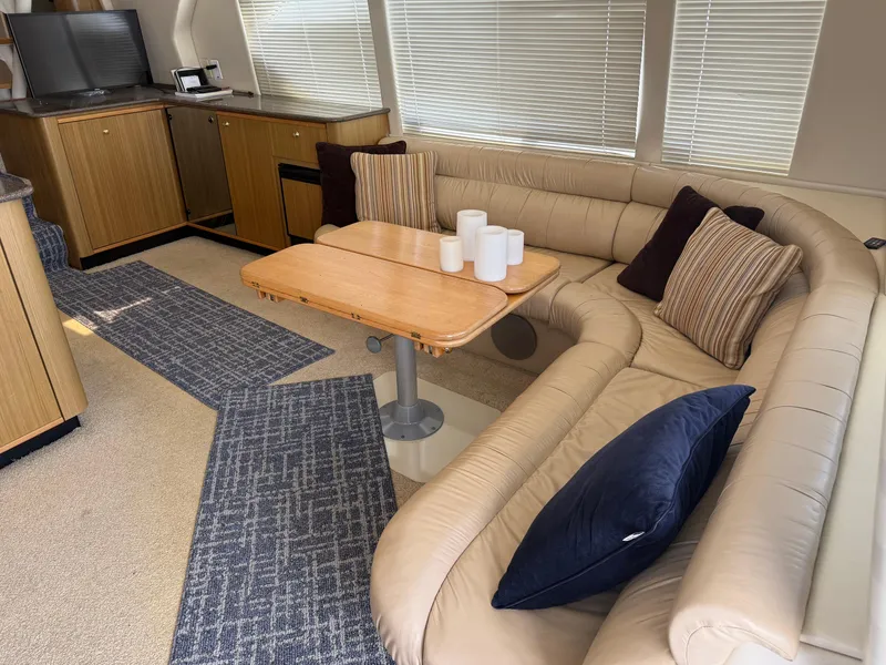 Slide: The Image of Luxurious interior of 2001 Bayliner 5288 Pilot House Motoryacht with cozy seating and elegant decor. - 10