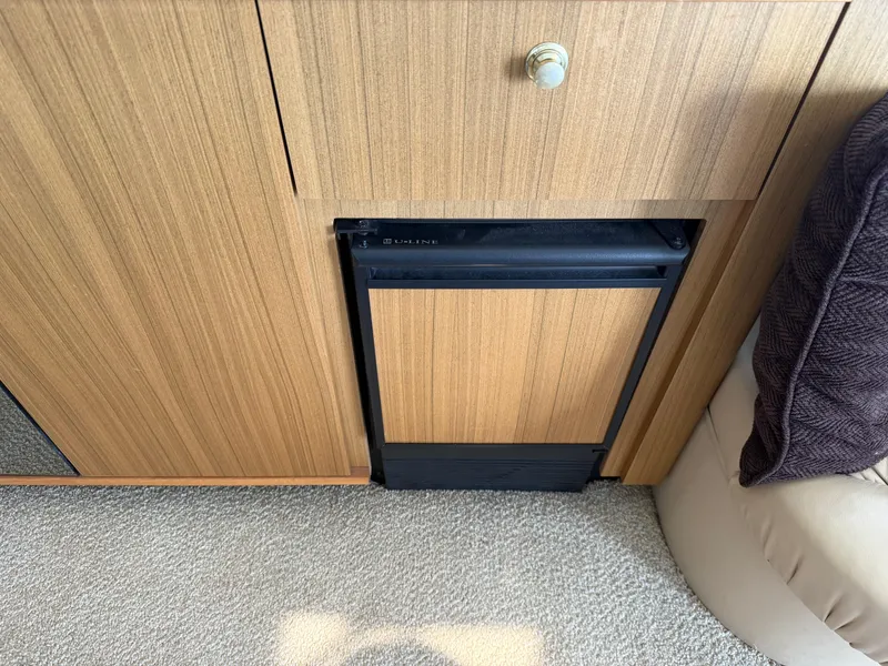 Slide: The Image of 2001 Bayliner 5288 Pilot House Motoryacht interior with built-in U-Line appliance. - 14