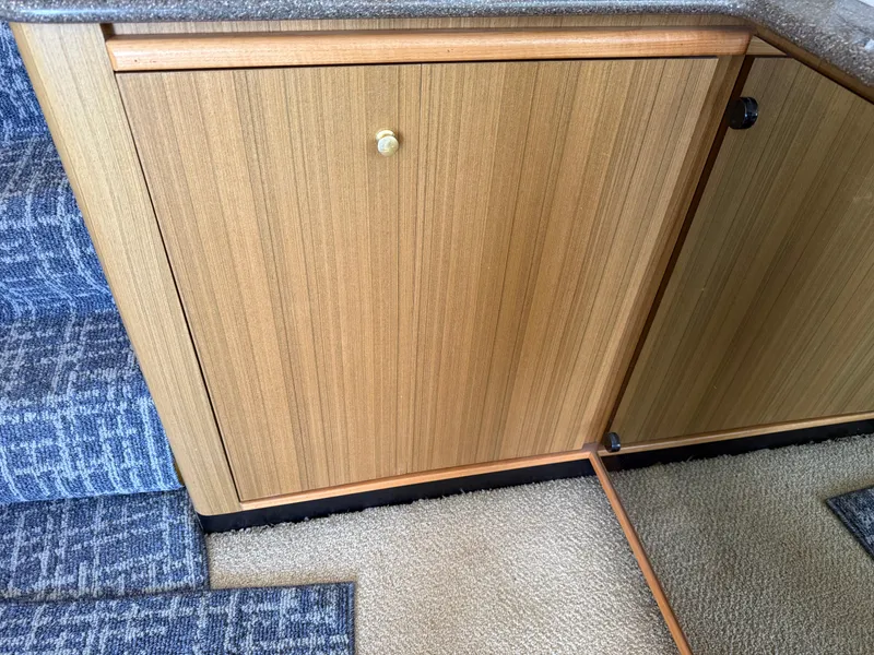 Slide: The Image of Wooden cabinet and carpeted stairs inside 2001 Bayliner 5288 Pilot House Motoryacht. - 15