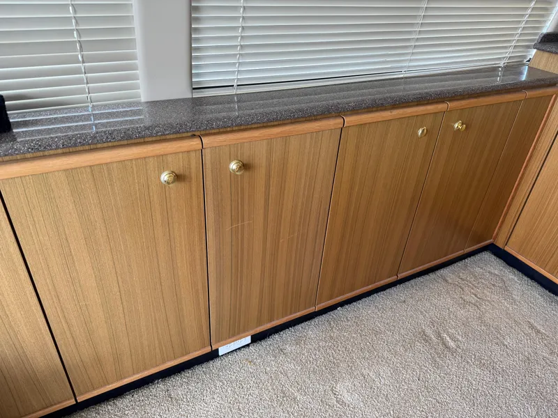 Slide: The Image of Wooden cabinets with brass knobs in a 2001 Bayliner 5288 Pilot House Motoryacht. - 18