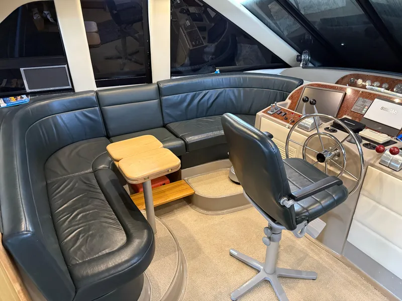 Slide: The Image of 2001 Bayliner 5288 Pilot House Motoryacht interior with leather seating and helm station. - 28