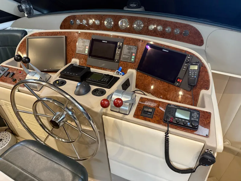 Slide: The Image of 2001 Bayliner 5288 Pilot House Motoryacht helm with navigation equipment and controls. - 30