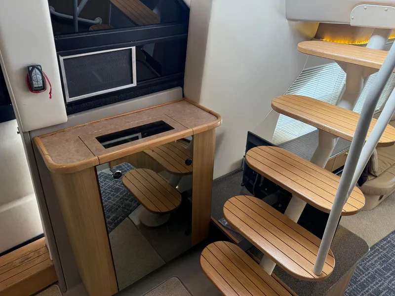 Slide: The Image of Interior of 2001 Bayliner 5288 Pilot House Motoryacht with wooden stairs and cabinet. - 36