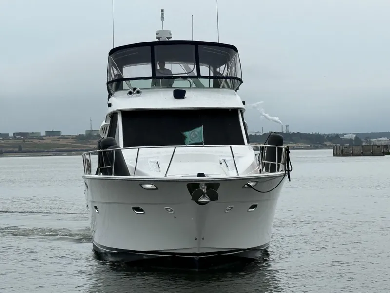 Slide: The Image of 2001 Bayliner 5288 Pilot House Motoryacht on calm water, front view. - 4