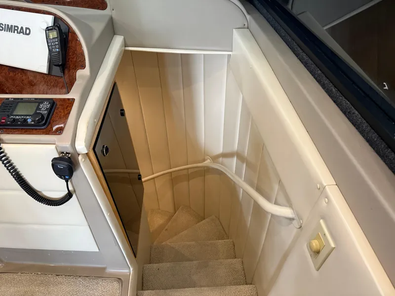 Slide: The Image of Staircase inside 2001 Bayliner 5288 Pilot House Motoryacht with control panel and radio. - 40