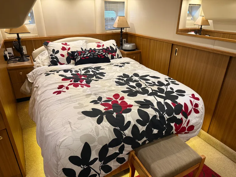 Slide: The Image of Luxurious bedroom in 2001 Bayliner 5288 Pilot House Motoryacht with floral bedding. - 42