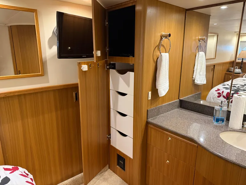 Slide: The Image of Interior of 2001 Bayliner 5288 Pilot House Motoryacht with wood cabinetry and modern amenities. - 47