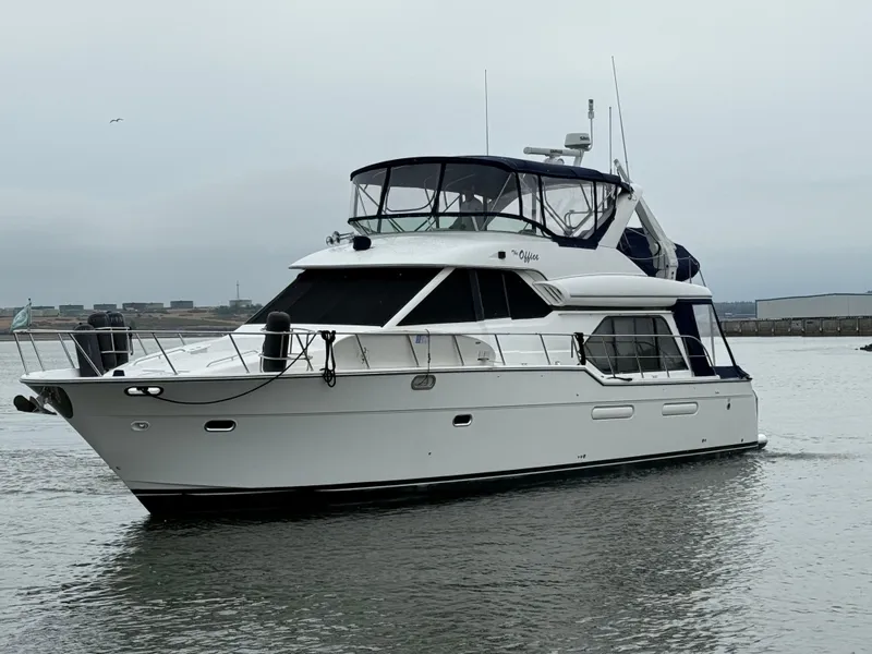 Slide: The Image of 2001 Bayliner 5288 Pilot House Motoryacht cruising on calm waters. - 6