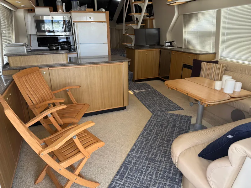 Slide: The Image of Interior of 2001 Bayliner 5288 Pilot House Motoryacht with wooden furniture and modern amenities. - 9