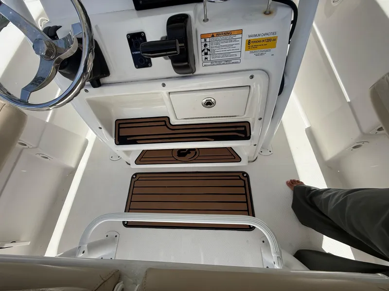 Slide: The Image of 2017 Sea Fox 226 Commander helm with steering wheel and control panel. - 4