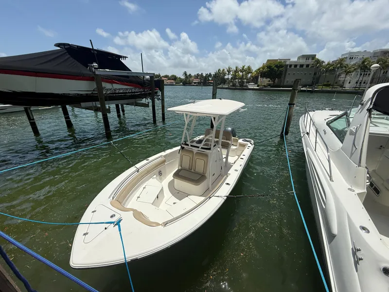 Slide: The Image of 2017 Sea Fox 226 Commander boat docked in sunny marina setting. - 6