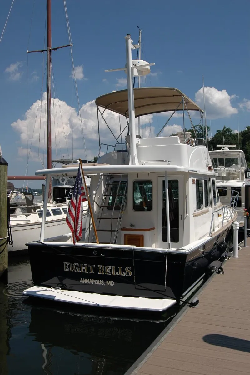 Slide: The Image of 2006 Sabre 36 Flybridge Sedan docked, displaying American flag, Annapolis, MD. - 12
