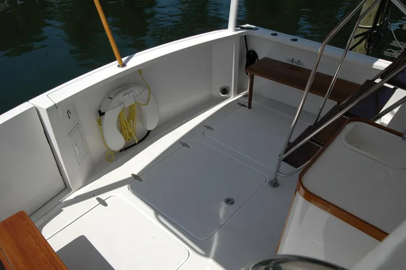 Slide: The Image of 2006 Sabre 36 Flybridge Sedan deck with life preserver and seating area. - 25