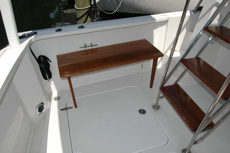 Slide: The Image of 2006 Sabre 36 Flybridge Sedan interior with wooden bench and stairs. - 27