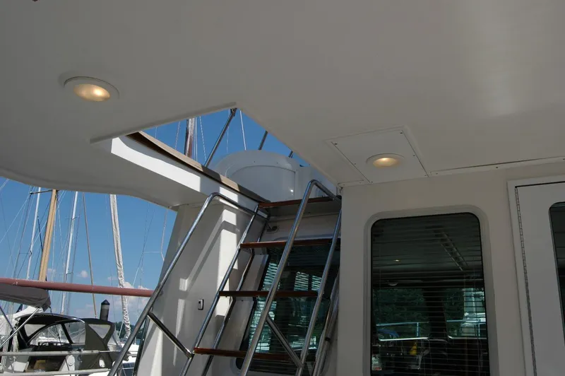 Slide: The Image of 2006 Sabre 36 Flybridge Sedan interior with stairs and windows, showcasing sleek design. - 28