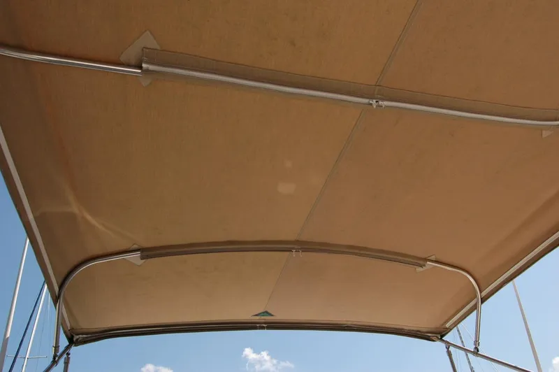 Slide: The Image of Bimini top of 2006 Sabre 36 Flybridge Sedan against blue sky. - 30