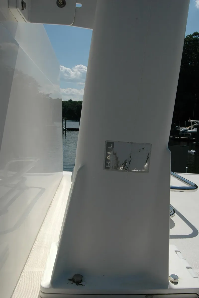 Slide: The Image of 2006 Sabre 36 Flybridge Sedan boat detail with water and dock in background. - 31