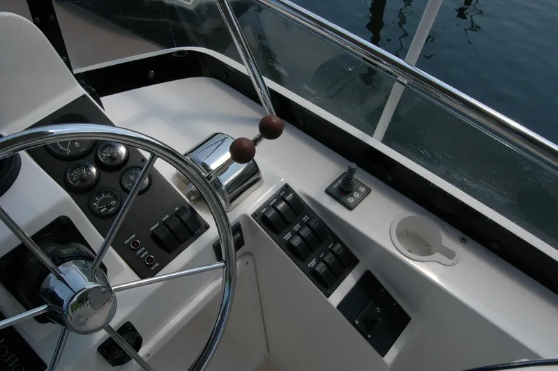 Slide: The Image of Helm of 2006 Sabre 36 Flybridge Sedan with steering wheel and control panel. - 36