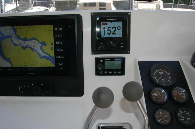 Slide: The Image of 2006 Sabre 36 Flybridge Sedan dashboard with navigation and control instruments. - 39