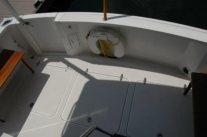 Slide: The Image of 2006 Sabre 36 Flybridge Sedan deck with storage hatches and life preserver. - 47