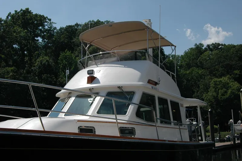 Slide: The Image of 2006 Sabre 36 Flybridge Sedan docked, featuring sleek design and spacious flybridge. - 5
