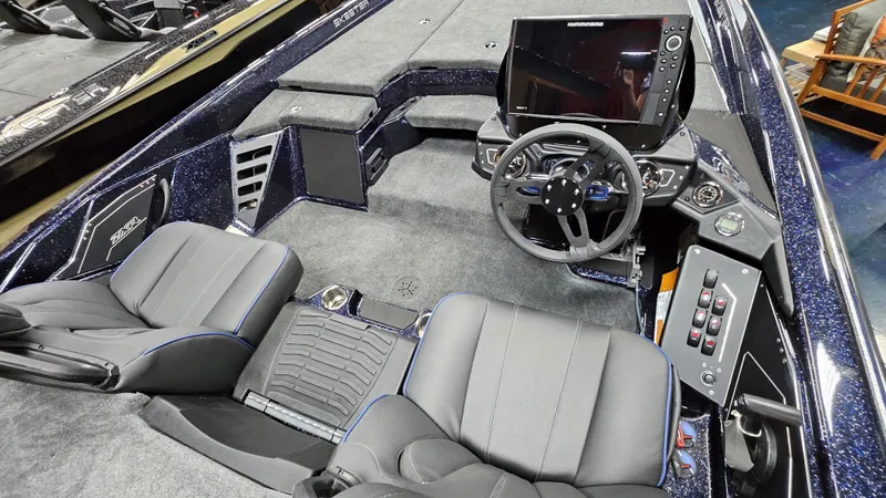 Slide: The Image of 2025 Skeeter ZXR 21 boat interior with steering wheel and control panel. - 17