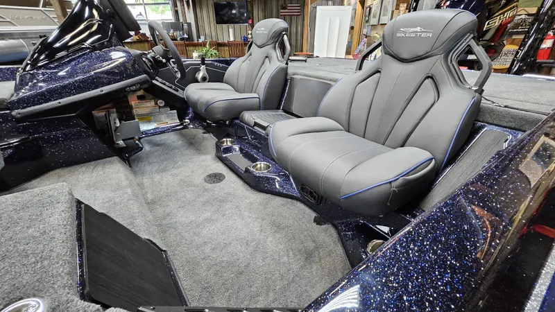 Slide: The Image of 2025 Skeeter ZXR 21 boat interior with sleek gray seats and modern dashboard. - 18