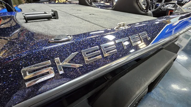 Slide: The Image of 2025 Skeeter ZXR 21 boat with metallic finish and logo detail. - 22