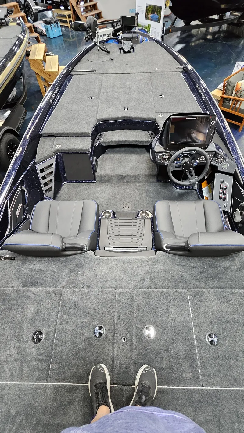 Slide: The Image of 2025 Skeeter ZXR 21 boat interior with dual seats and modern dashboard. - 24