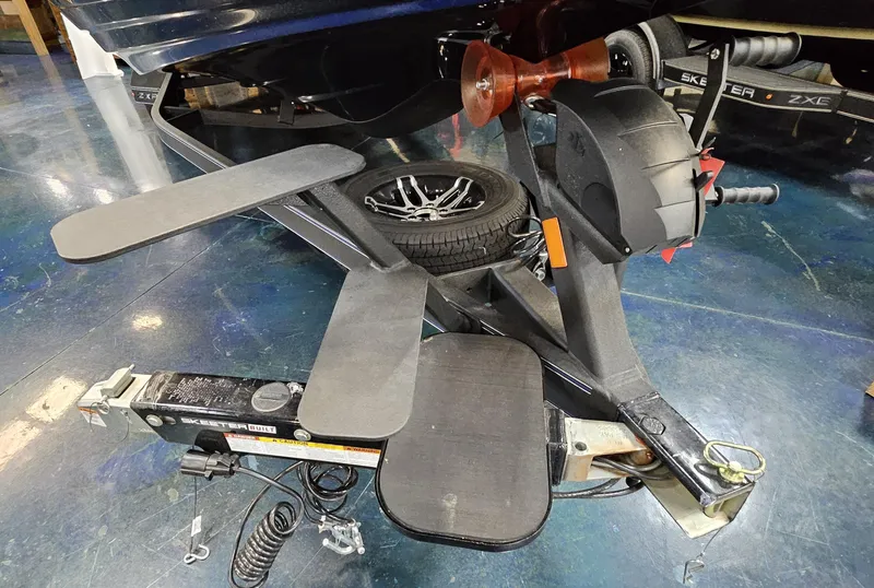 Slide: The Image of Trailer hitch and components of a 2025 Skeeter ZXR 21 boat. - 26