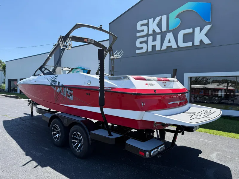 Slide: The Image of 2011 Axis A22 boat in red and white at Ski Shack dealership. - 6