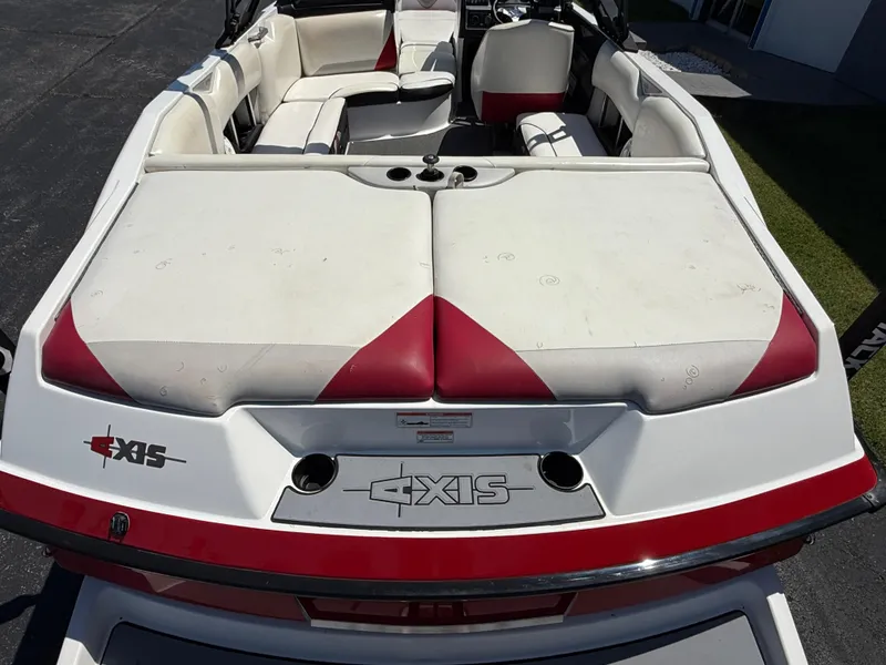 Slide: The Image of 2011 Axis A22 boat with red and white seating, viewed from the rear. - 7