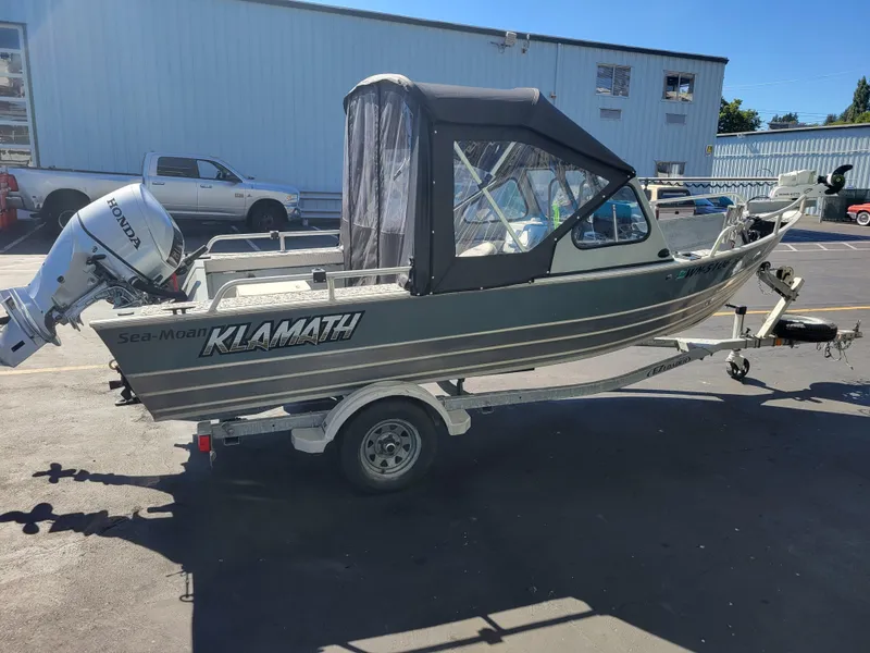 Slide: The Image of 2018 Klamath 18 OPW boat with Honda outboard motor on trailer. - 6