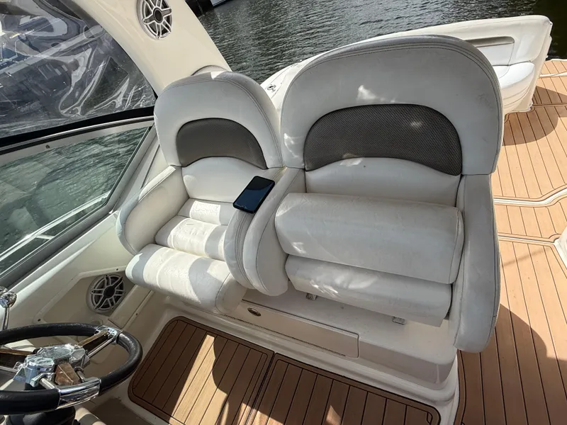Slide: The Image of Luxury seating on 2005 Sea Ray 340 Sundancer boat with wooden deck. - 12