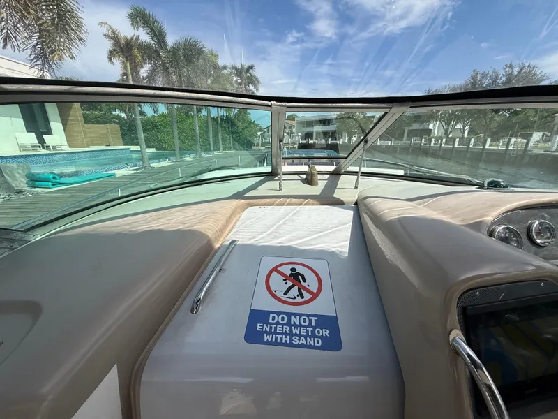 Slide: The Image of 2005 Sea Ray 340 Sundancer boat interior with "Do Not Enter Wet" sign. - 16