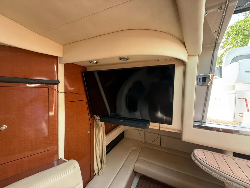 Slide: The Image of Interior of 2005 Sea Ray 340 Sundancer with TV and seating area. - 22