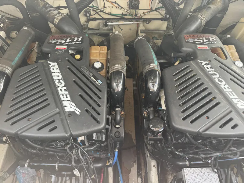 Slide: The Image of Twin Mercury engines in a 2005 Sea Ray 340 Sundancer boat. - 32