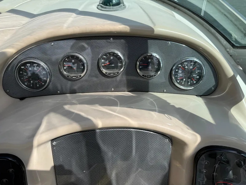 Slide: The Image of Dashboard of 2005 Sea Ray 340 Sundancer boat with gauges and controls. - 5